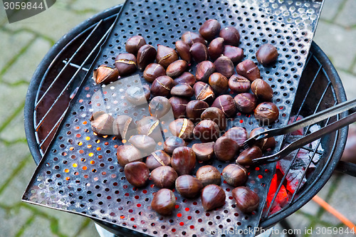 Image of Grilling chestnuts.