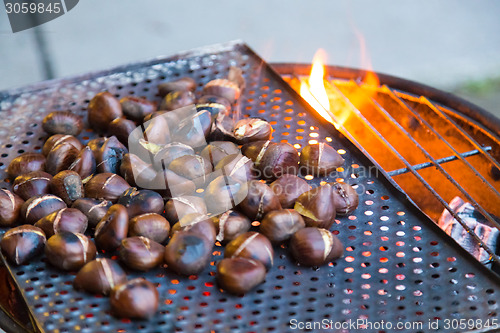 Image of Grilling chestnuts.