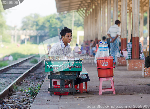 Image of Vendor at a railway station in Yangon, Myanmar.