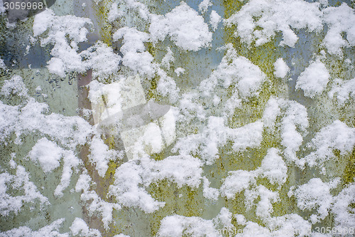 Image of snowhats on a fence