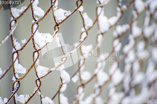 Image of snowhats on a fence