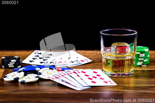 Image of Gambling scene with cards and chips