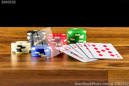 Image of Gambling scene with cards and chips