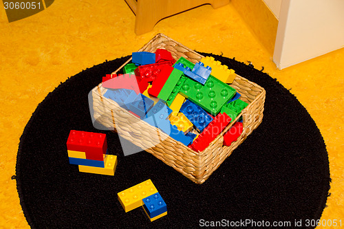 Image of Plastic toys in box a childrens room ready to play with