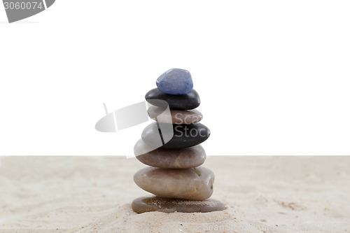 Image of Balanced pebbles on sand
