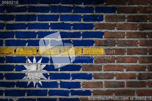 Image of Brick wall texture with flag