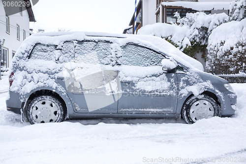 Image of car covered in snow