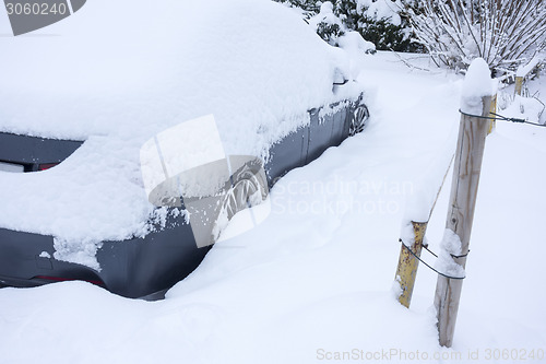 Image of car covered in snow