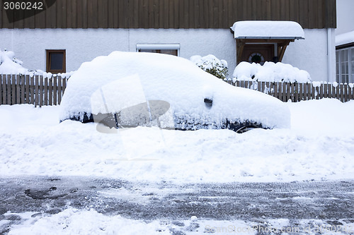 Image of car covered in snow