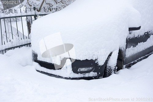 Image of car covered in snow