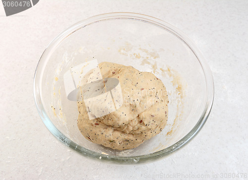 Image of Freshly kneaded bread dough in a glass bowl