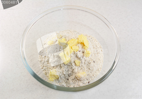 Image of Adding butter to a bread mix