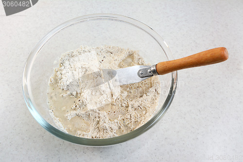 Image of Mixing water and bread flour mix