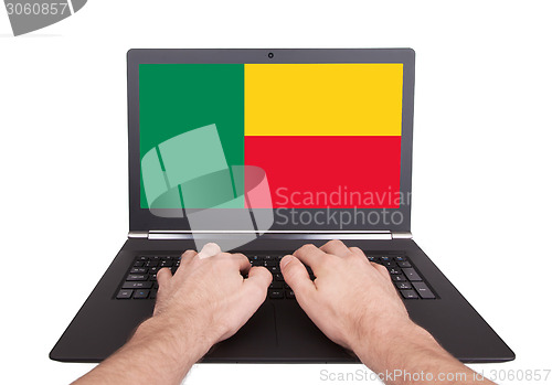 Image of Hands working on laptop, Benin