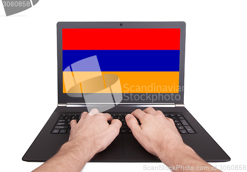 Image of Hands working on laptop, Armenia