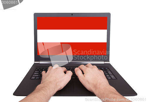 Image of Hands working on laptop, Austria
