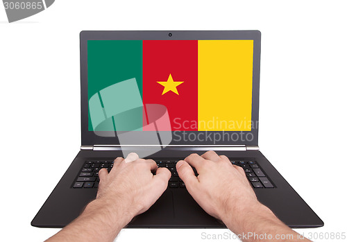 Image of Hands working on laptop, Cameroon