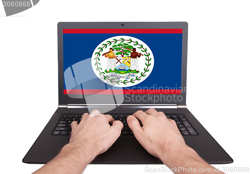 Image of Hands working on laptop, Belize