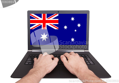 Image of Hands working on laptop, Australia