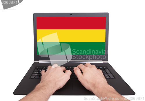 Image of Hands working on laptop, Bolivia