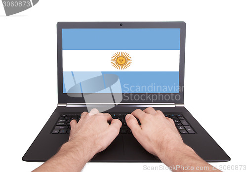Image of Hands working on laptop, Argentina