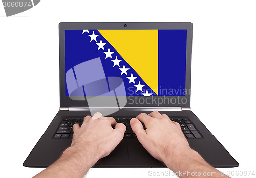 Image of Hands working on laptop, Bosnia and Herzegovina