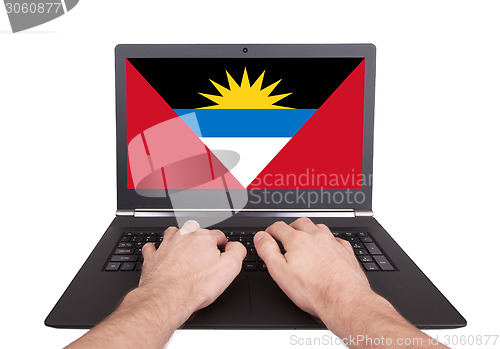Image of Hands working on laptop, Antigua and Barbuda