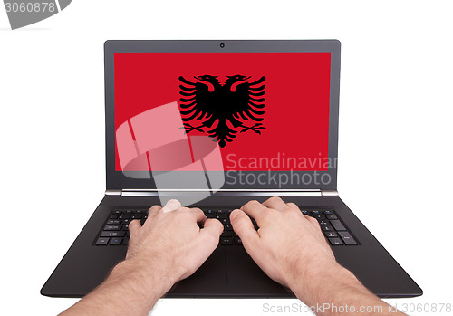 Image of Hands working on laptop, Albania