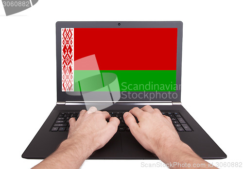 Image of Hands working on laptop, Belarus