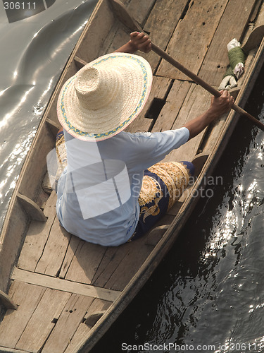Image of Asian woman in boat