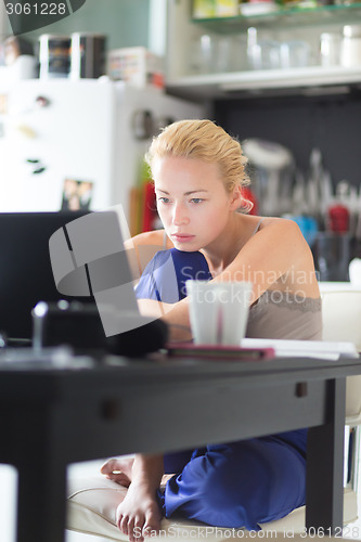 Image of Female freelancer working from home.