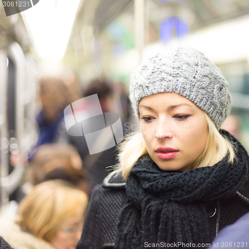 Image of Woman on subway.