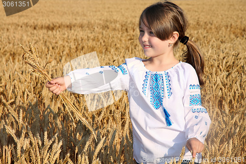 Image of small rural girl on wheat field