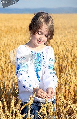 Image of small rural girl on wheat field