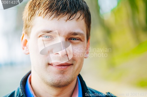 Image of Handsome Man Outdoors Portrait. Spring Colours.