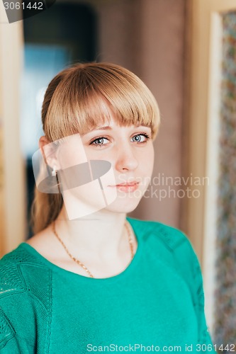 Image of Beautiful Girl Woman In Green Jacket At Home