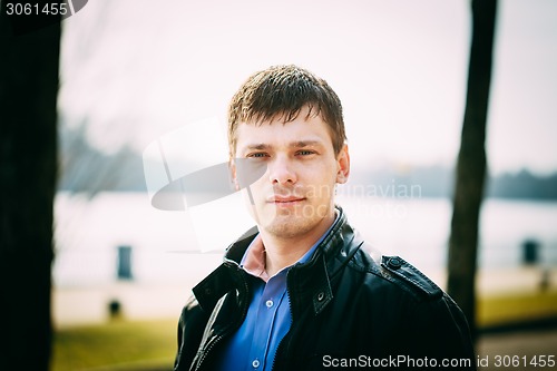 Image of Handsome Man Outdoors Portrait. Spring Colours.