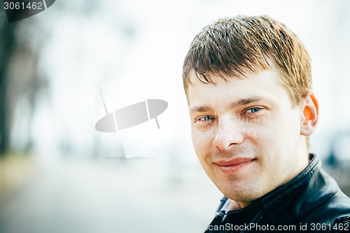Image of Handsome Man Outdoors Portrait. Spring Colours.