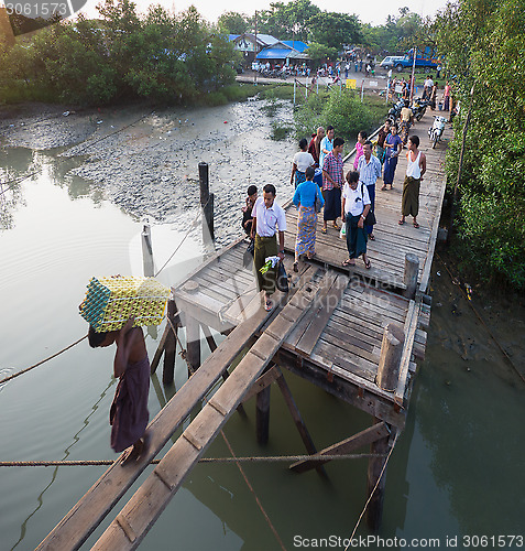 Image of Passengers boarding a ferry in Sittwe, Myanmar