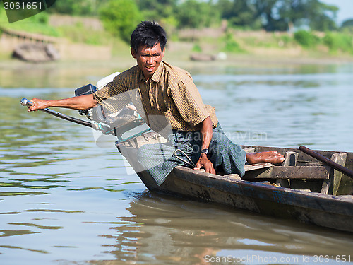 Image of Burmese helmsman on the Lemro River