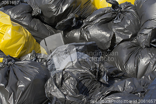 Image of Black and yellow garbage bag 