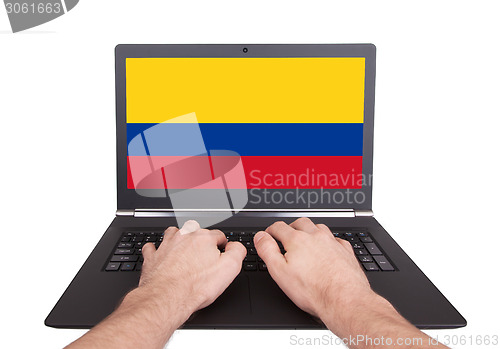 Image of Hands working on laptop, Colombia