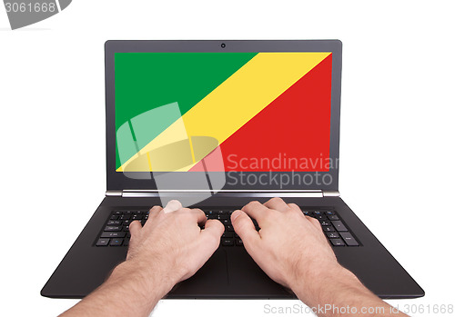 Image of Hands working on laptop, Conga