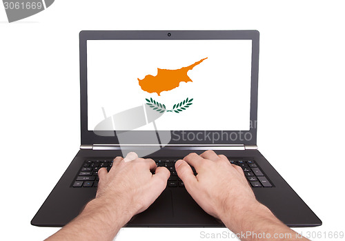 Image of Hands working on laptop, Cyprus