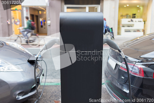 Image of Electric Car in Charging Station.