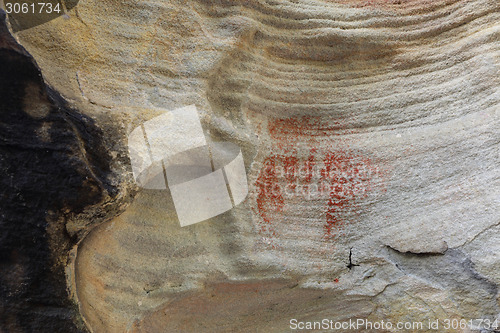 Image of Prehistoric aboriginal hand print using red ochre Australia