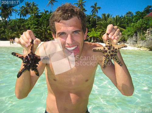 Image of Man having fun on the beach.