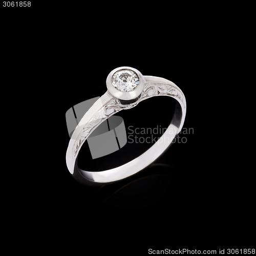 Image of Engagement diamond ring on black background