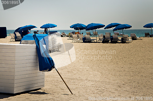 Image of Sun umbrellas on a sandy beach