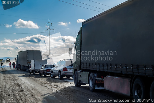 Image of Trucks stopped on highway after heavy snow storm